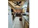 Kitchen with wood cabinets, granite counters, and open layout at 7632 Sw 112Th Ln, Ocala, FL 34476