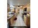 Kitchen with light wood cabinets and granite countertops at 7632 Sw 112Th Ln, Ocala, FL 34476