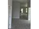 Bright hallway with wood-look tile floors leading to other rooms at 7661 Sw 180Th Cir, Dunnellon, FL 34432