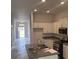 Open concept kitchen with an island and stainless steel appliances at 7661 Sw 180Th Cir, Dunnellon, FL 34432
