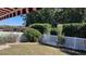 Private backyard with green lawn, white fence and lush landscaping at 7729 Sw 85Th Cir, Ocala, FL 34481