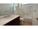 Bathroom with single vanity, tub, and shower at 7729 Sw 85Th Cir, Ocala, FL 34481