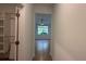 Hallway with tile floors and access to bedrooms and closets at 7729 Sw 85Th Cir, Ocala, FL 34481