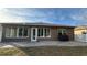 Single story home with awning covered patio and fenced backyard at 7729 Sw 85Th Cir, Ocala, FL 34481
