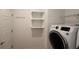 Laundry room with washer, dryer, and shelving at 7729 Sw 85Th Cir, Ocala, FL 34481