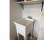 Laundry area with utility sink and shelving at 7729 Sw 85Th Cir, Ocala, FL 34481