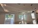 Bright and airy living room with tile floors and access to a sunroom at 7729 Sw 85Th Cir, Ocala, FL 34481
