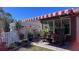 Relaxing patio with striped awning, comfortable seating, and potted plants at 7729 Sw 85Th Cir, Ocala, FL 34481
