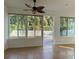 Sunroom with sliding doors leading to backyard at 7729 Sw 85Th Cir, Ocala, FL 34481