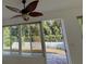 Bright sunroom with view of backyard and white fence at 7729 Sw 85Th Cir, Ocala, FL 34481