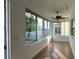 Sunroom with tile flooring and multiple windows at 7729 Sw 85Th Cir, Ocala, FL 34481