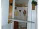 Bathroom with a built-in ironing board and charming decor at 7990 Midway Drive Ter # M102, Ocala, FL 34472