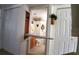 Small bathroom with built-in ironing board and toilet at 7990 Midway Drive Ter # M102, Ocala, FL 34472