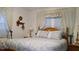 Bedroom with wooden bed frame and blue bedding at 7990 Midway Drive Ter # M102, Ocala, FL 34472