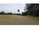View of a lush green golf course with oak trees at 7990 Midway Drive Ter # M102, Ocala, FL 34472