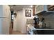 Bright kitchen featuring wood cabinets, black countertops, and a stove at 7990 Midway Drive Ter # M102, Ocala, FL 34472