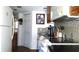 Bright kitchen featuring wood cabinets, black countertops, and a stove at 7990 Midway Drive Ter # M102, Ocala, FL 34472