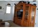 View of an entertainment center and a portion of a living room at 7990 Midway Drive Ter # M102, Ocala, FL 34472