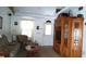 Cozy living room featuring a sofa, chairs, and a large entertainment center at 7990 Midway Drive Ter # M102, Ocala, FL 34472
