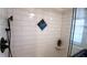 Updated shower with subway tile, a niche, and a glass enclosure at 7990 Midway Drive Ter # M102, Ocala, FL 34472