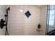 Updated shower with subway tile, a niche, and a glass enclosure at 7990 Midway Drive Ter # M102, Ocala, FL 34472