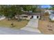 Single story home, driveway, and yard at 8111 Sw 108Th Street Rd, Ocala, FL 34481