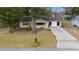 Single story house with driveway and yard at 8111 Sw 108Th Street Rd, Ocala, FL 34481