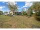 House exterior view with backyard, patio, and landscaping at 8111 Sw 108Th Street Rd, Ocala, FL 34481