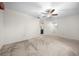 Spacious bedroom with ceiling fan and carpet at 8111 Sw 108Th Street Rd, Ocala, FL 34481