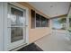 Front porch with a decorative door and brown shutters at 8111 Sw 108Th Street Rd, Ocala, FL 34481