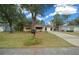 House exterior with a driveway and well-maintained lawn at 8111 Sw 108Th Street Rd, Ocala, FL 34481