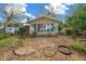 Exterior view of house, landscaping, and backyard at 8111 Sw 108Th Street Rd, Ocala, FL 34481