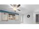 Bright living room with window, door, and ceiling fan at 8111 Sw 108Th Street Rd, Ocala, FL 34481