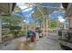 Screened porch with concrete floor and partial view at 8111 Sw 108Th Street Rd, Ocala, FL 34481
