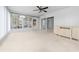 Sunroom with sliding doors, neutral carpeting and built-in cabinet at 8111 Sw 108Th Street Rd, Ocala, FL 34481