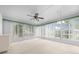 Bright sunroom with multiple windows and carpet at 8111 Sw 108Th Street Rd, Ocala, FL 34481