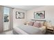 Bedroom with a queen-size bed, neutral color palette, and modern art at 8699 Sw 44Th Ter, Ocala, FL 34476