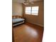 Bedroom with a daybed and hardwood floors at 8707 Sw 88Th Court Rd # B, Ocala, FL 34481