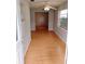 Simple dining room with wood floors and access to the outdoors at 8707 Sw 88Th Court Rd # B, Ocala, FL 34481