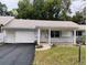 Ranch style home with carport and mature landscaping at 8707 Sw 88Th Court Rd # B, Ocala, FL 34481
