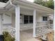 Covered porch with white columns and railings at 8707 Sw 88Th Court Rd # B, Ocala, FL 34481