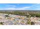 Aerial view of a residential neighborhood with various homes at 9099 Se 118Th Ln, Summerfield, FL 34491