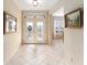 Spacious entryway with tile flooring and access to other rooms at 9099 Se 118Th Ln, Summerfield, FL 34491