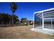 Expansive fenced backyard with a lanai and lots of mature landscaping at 9340 Sw 9Th Ter, Ocala, FL 34476