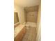 Cozy bathroom features a tiled shower and tub combination, plus a single vanity at 9340 Sw 9Th Ter, Ocala, FL 34476