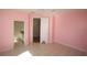 Bedroom featuring neutral flooring, ensuite bathroom and walk in closet at 9340 Sw 9Th Ter, Ocala, FL 34476