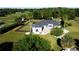 Expansive home with a lush lawn, mature trees and landscaping, and a black fence surrounding the perimeter at 9340 Sw 9Th Ter, Ocala, FL 34476