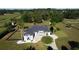 Expansive home with a lush lawn, mature trees and landscaping, and a black fence surrounding the perimeter at 9340 Sw 9Th Ter, Ocala, FL 34476
