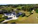 Large home with a pool, expansive lawn, and a black fence surrounding the perimeter at 9340 Sw 9Th Ter, Ocala, FL 34476