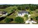 Expansive home with a lush lawn, mature trees and landscaping, and a black fence surrounding the perimeter at 9340 Sw 9Th Ter, Ocala, FL 34476